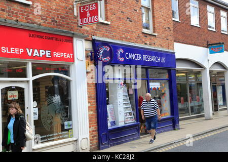 cancer research uk e cigarettes Cancer Research UK charity next to Vaping electronic cigarette shop, East  Dereham, Norfolk, England, UK Stock Photo