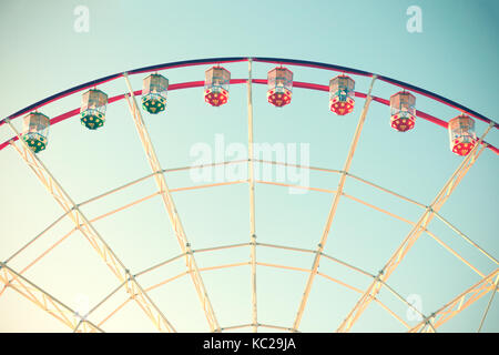 Ferris wheel against the blue sky. Stock Photo