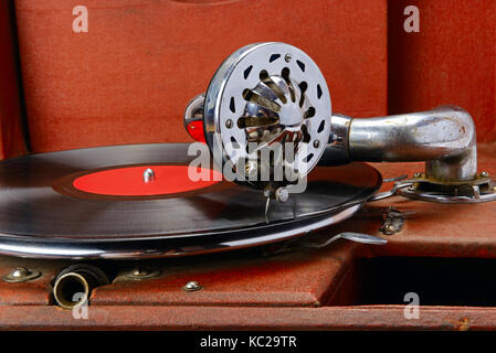 Vintage gramophone with vinyl disc. Close-up. Stock Photo