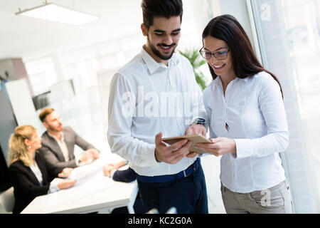 Young attractive architects using digital tablet in office Stock Photo