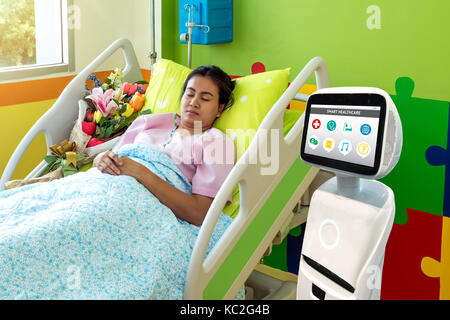 Robotic advisor service technology in healthcare smart hospital , artificial intelligence concept. Robot in patient room. Stock Photo