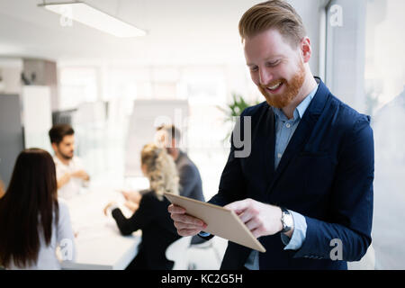 Portrait of young handsome architect on meeting Stock Photo