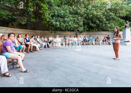 LIVADIYA, CRIMEA - SEPTEMBER 21, 2017: tourists listen to the guide in front of Livadia Palace entrance. The palace was the summer residence of the Ru Stock Photo