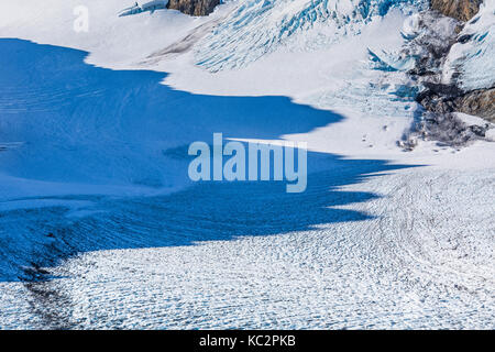 Shadows crossing Blue Glacier and Glacier Pass in the dramatic setting below Mount Olympus at the end of the Hoh River Trail in Olympic National Park, Stock Photo