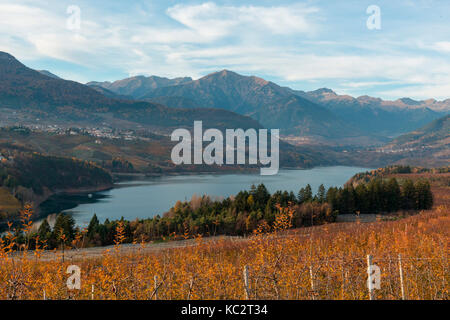 Italy, Trentino Alto Adige, play of light on the St. Giustina lake in Non Valley on a cloudy day. Stock Photo