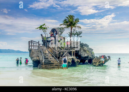 BORACAY, PHILIPPINES - 16 SEP 2015: Willys Rock, situated on the famous White Beach, is one of the most recognizable landmarks of Boracay Island, Phil Stock Photo