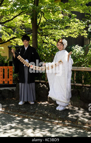 Kyoto, Japan - May 18, 2017:Just married couple in kimono on a trip in Kyoto are posing for a picture Stock Photo