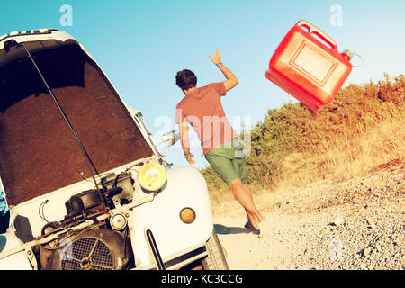 Man walking away from broken down car Stock Photo - Alamy