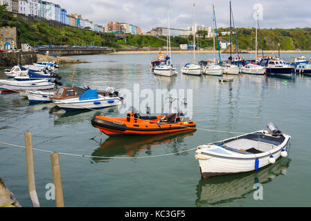 Boats moored in the harbour at high tide. Tenby, Carmarthen Bay, Pembrokeshire, Wales, UK, Britain