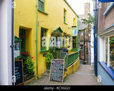 The Plantagenet House restaurant and Tudor Merchant's House on narrow lane. Quay Hill, Tenby, Pembrokeshire, South Wales, UK, Britain Stock Photo