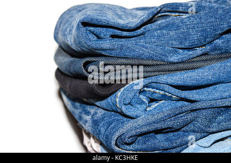 jeans stacked isolated on white background. Stock Photo