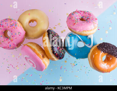 flying doughnuts on blue Stock Photo