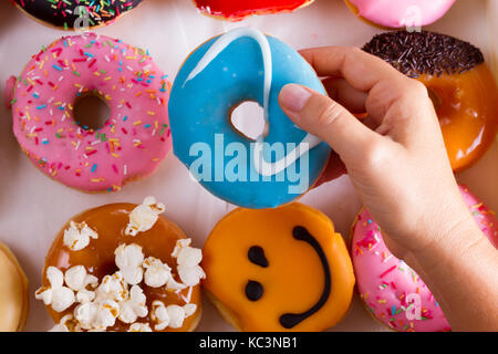 sweet doughnuts on gray stone background Stock Photo