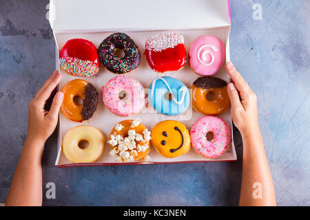 sweet doughnuts on gray stone background Stock Photo
