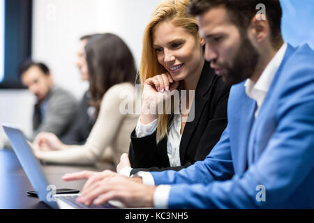 Portrait of business couple in conference room Stock Photo