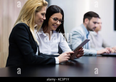 Two businesswomen having discussion in conference room Stock Photo
