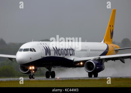 G-OZBM Monarch Airlines Airbus A321-200 Monarch Airlines aircraft about to take off in bad weather at Luton airport Bedfordshire Stock Photo