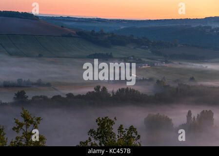 Early morning mist in the Cerou Valley, near Cordes-sur-Ciel, Occitanie, France. Stock Photo