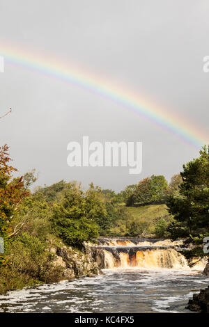 Low Force, Teesdale, County Durham, UK. 2nd Oct, 2017. UK Weather. A beautiful rainbow forms over Low Force waterfall on the River Tees as strong winds drive heavy rain showers across Upper Teesdale in County Durham. Credit: David Forster/Alamy Live News Stock Photo