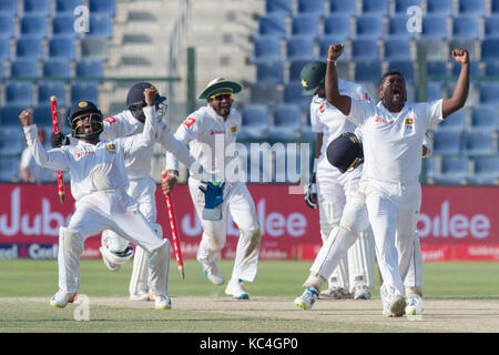 Abu Dhabi, UAE. 2nd Oct, 2017. Sri Lanka celebrates the final wicket of Mohammad Abbas to win the First Test between Pakistan and Sri Lanka at Sheikh Zayed stadium on October 2, 2017 in Abu Dhabi, United Arab Emirates Credit: Isuru Peiris/Alamy Live News Stock Photo