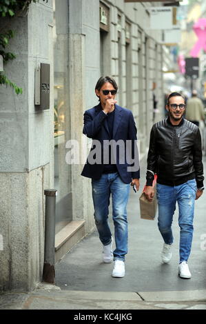 Milan, Filippo Inzaghi walking in the center with a friend Filippo 'Pippo' Inzaghi, former AC Milan and national football player, now trains VENICE in Serie B. He is surprised to walk in the center together with a friend. Stock Photo