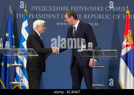 (171002) -- BELGRADE, Oct. 2, 2017 (Xinhua) -- Visiting Greek President Prokopis Pavlopoulos (L) shakes hands with his Serbian counterpart Aleksandar Vucic at a joint press conference in Belgrade, Serbia, Oct. 2, 2017. Greece will support Serbia as well as all other Balkan countries who wish to become part of the European Union (EU), but these countries must respect international right, as well as European principles and heritage, said Greek President Prokopis Pavlopoulos during his visit to Serbia on Monday. (Xinhua/Nemanja Cabric) Stock Photo