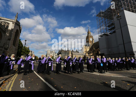London, UK. 02nd Oct, 2017. Judges looking resplendent in their black and purple robes and wigs, as they process from Westminster Abbey to the Houses of Parliament. A service in Westminster Abbey is conducted by the Dean of Westminster to mark the start of the legal year. Judges, law officers, Queen's Counsel (QC), government ministers and lawyers attend the service, with Judges and QC's wearing ceremonial dress. Judges process on The Start of the Legal Year in Westminster, London, on October 2nd, 2017. Credit: Paul Marriott/Alamy Live News Stock Photo
