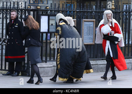 London, UK. 02nd Oct, 2017. A Judge gets their robe inflated in the high winds, as they arrive at Westminster Abbey before processing to the Houses of Parliament. A service in Westminster Abbey is conducted by the Dean of Westminster to mark the start of the legal year. Judges, law officers, Queen's Counsel (QC), government ministers and lawyers attend the service, with Judges and QC's wearing ceremonial dress. Judges process on The Start of the Legal Year in Westminster, London, on October 2nd, 2017. Credit: Paul Marriott/Alamy Live News Stock Photo
