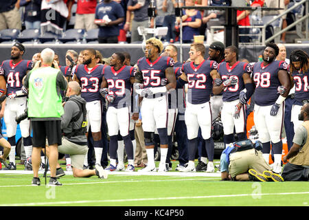Houston, Texas, USA. 1st Oct, 2017. Members of the Houston Texans stand with arms locked together during the national anthem prior to an NFL regular season game between the Houston Texans and the Tennessee Titans at NRG Stadium. Credit: Erik Williams/ZUMA Wire/Alamy Live News Stock Photo