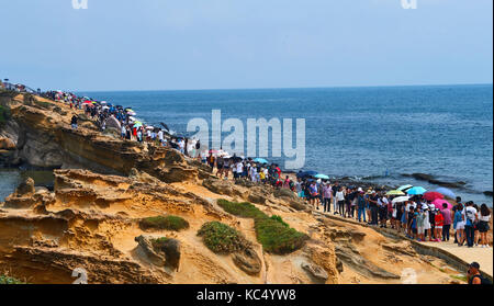 Taipei, Taiwan. 3rd Oct, 2017. Tourists visit Yehliu Geopark in New Taipei of southeast China's Taiwan, Oct. 3, 2017. The geopark features stunning geological landscape formed by wave attack, rock weathering, earth movement and crustal movement, which make it a famous destination for tourists. Credit: Zhao Yingquan/Xinhua/Alamy Live News Stock Photo