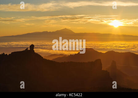 Golden sunset with view over the roque nublo to the Mount Teide, Tenerife, Gran Canaria Stock Photo
