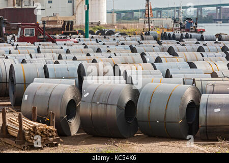 Sault Ste. Marie, Ontario Canada - Steel rolls on the dock at the Algoma steel mill on the shore of the St. Mary's River. Stock Photo