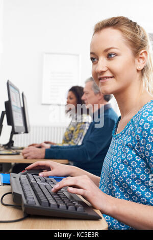 Young Woman Attending Computer Class Stock Photo