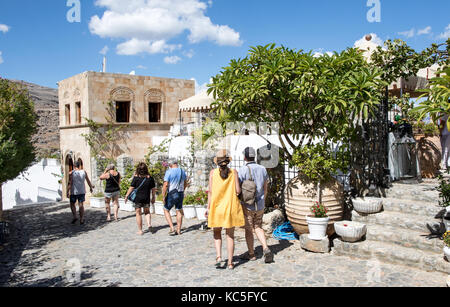 Tourists walking around Lindos Greek Islands Greece Stock Photo