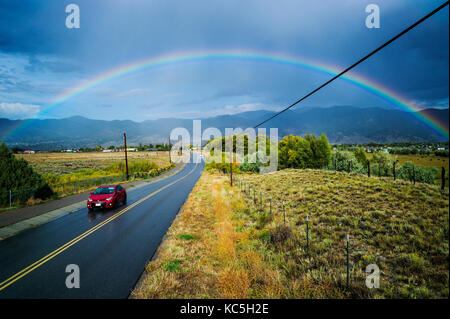 Rainbow over CR 120 & the small mountain town of Salida, Colorado, USA Stock Photo