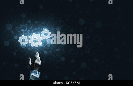 Technology conceptual image with gear digital symbol on dark background Stock Photo