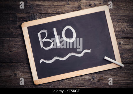 bio Handwritten With White Chalk On A Blackboard Stock Photo