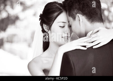 close-up portrait of intimate wedding couple, black and white. Stock Photo