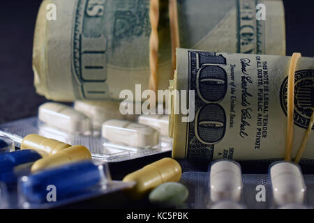 Close up of money and pills. Stock Photo