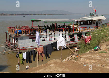 MANDALAY, MYANMAR, December 12, 2014 : Boats on Irrawaddy river. After Rudyard Kipling's poem, the river is sometimes referred to as 'The Road to Mand Stock Photo