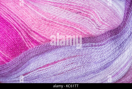 A super close up image of amethyst yarn Background of purple yarn, knitting Lilac, pinkwoolen thread Stock Photo