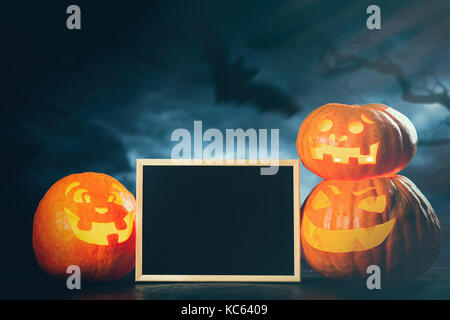 Three halloween Jack O' Lantern pumpkins Stock Photo