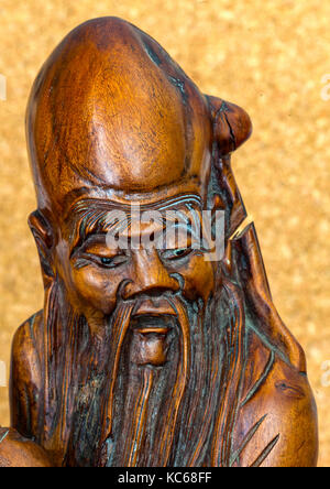 Antique statue of Chinese man with beard Stock Photo