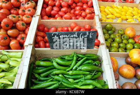 Market stall selling tomatoes and chillis in Provenge, France Stock Photo