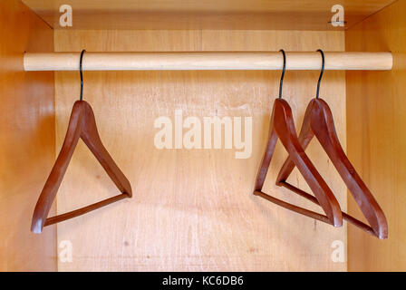 Empty hangers in wardrobe Stock Photo