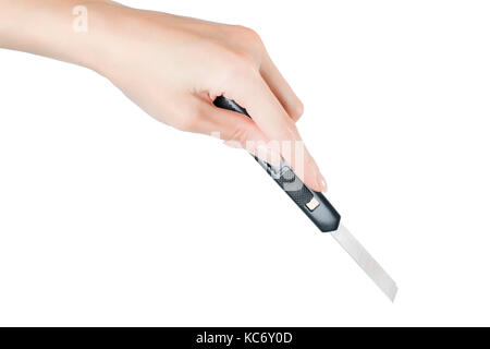 Woman hand cutting something with paper knife. Isolated on white, clipping path included Stock Photo