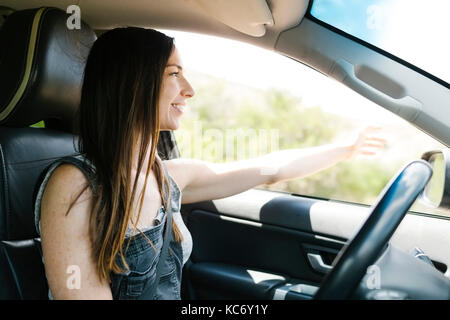 Smiling woman driving car Stock Photo