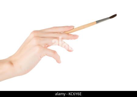 Woman hand drawing or touching something with brush. Isolated on white, clipping path included Stock Photo