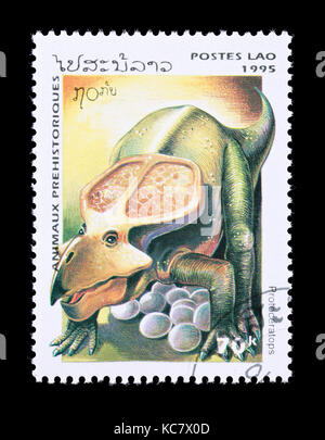 Postage stamp from Laos depicting a protoceratops Stock Photo