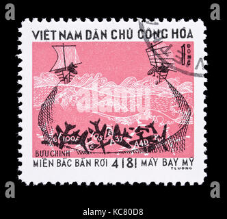 Postage stamp from Vietnam depicting airplane wreckage caught in a fishing net. Stock Photo